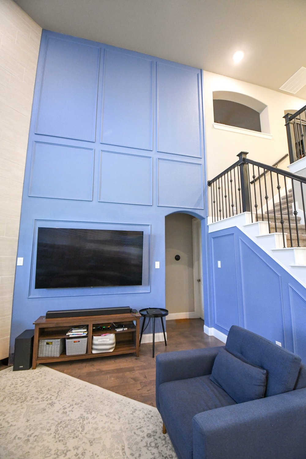 The blue wall and stair from the sofa's corner