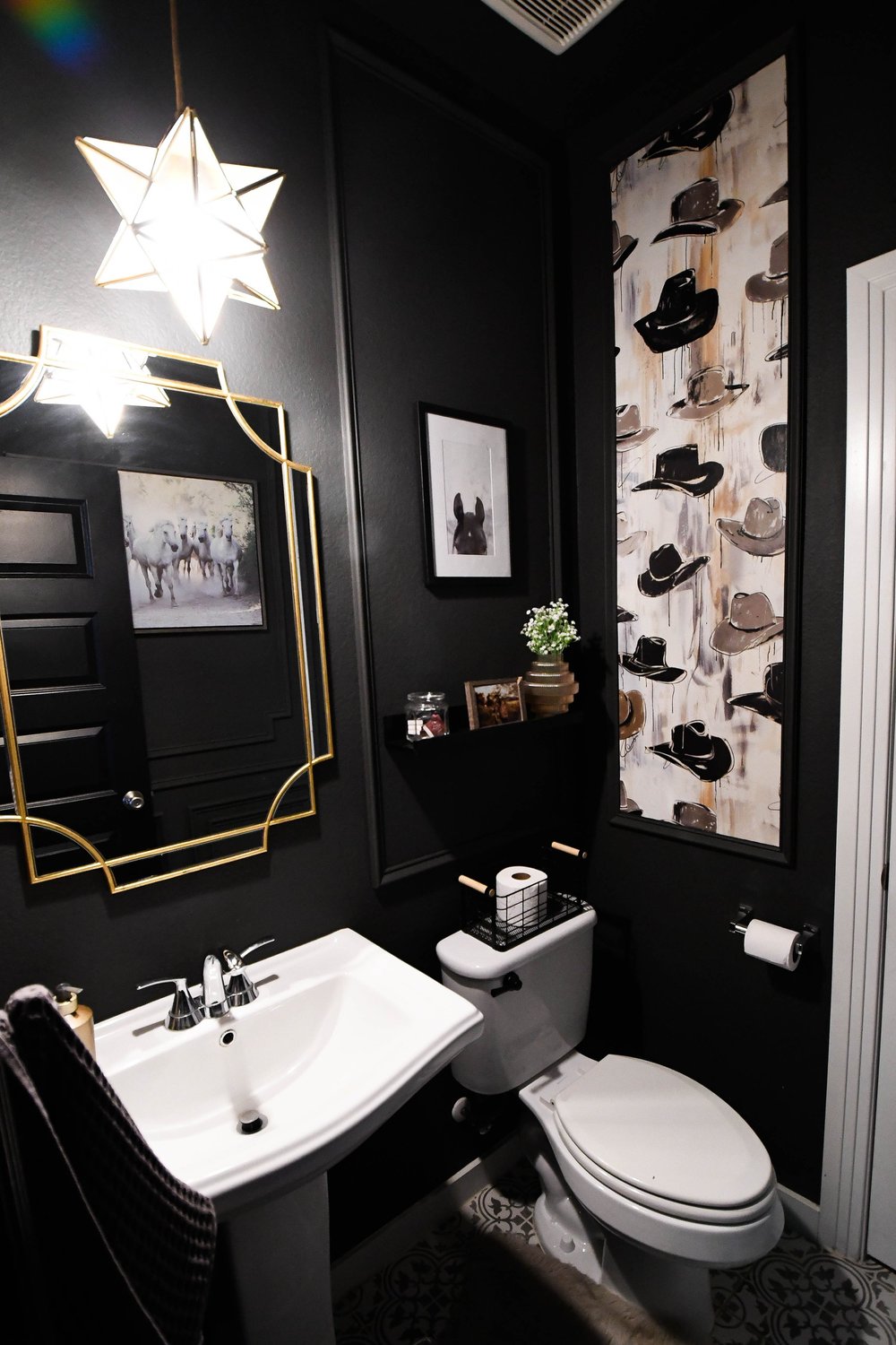 The powder bath's sink, toilet and cowboy hat wallpaper together