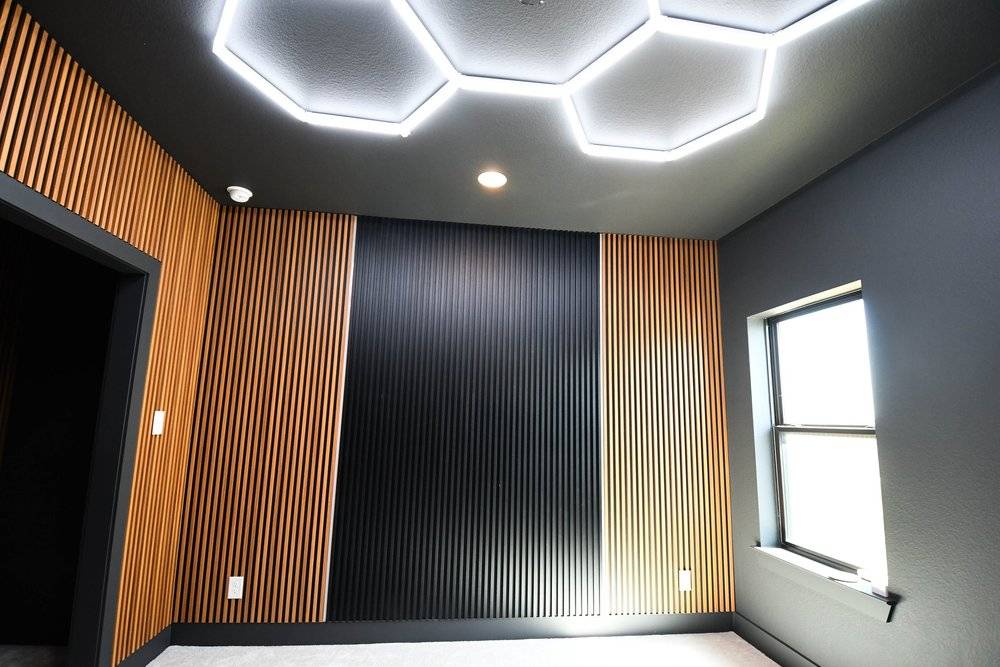 The finished wall treatment across the room with the window at the right