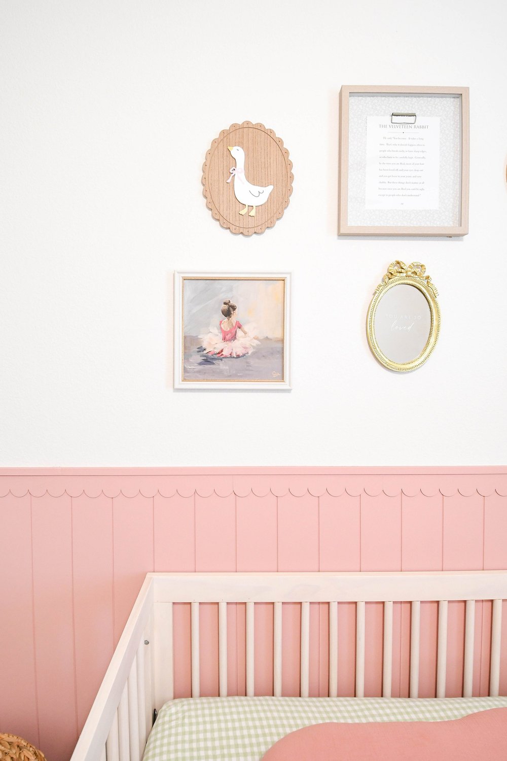 Gallery wall of a goose plaque, framed print and oval gold mirror above the panelling