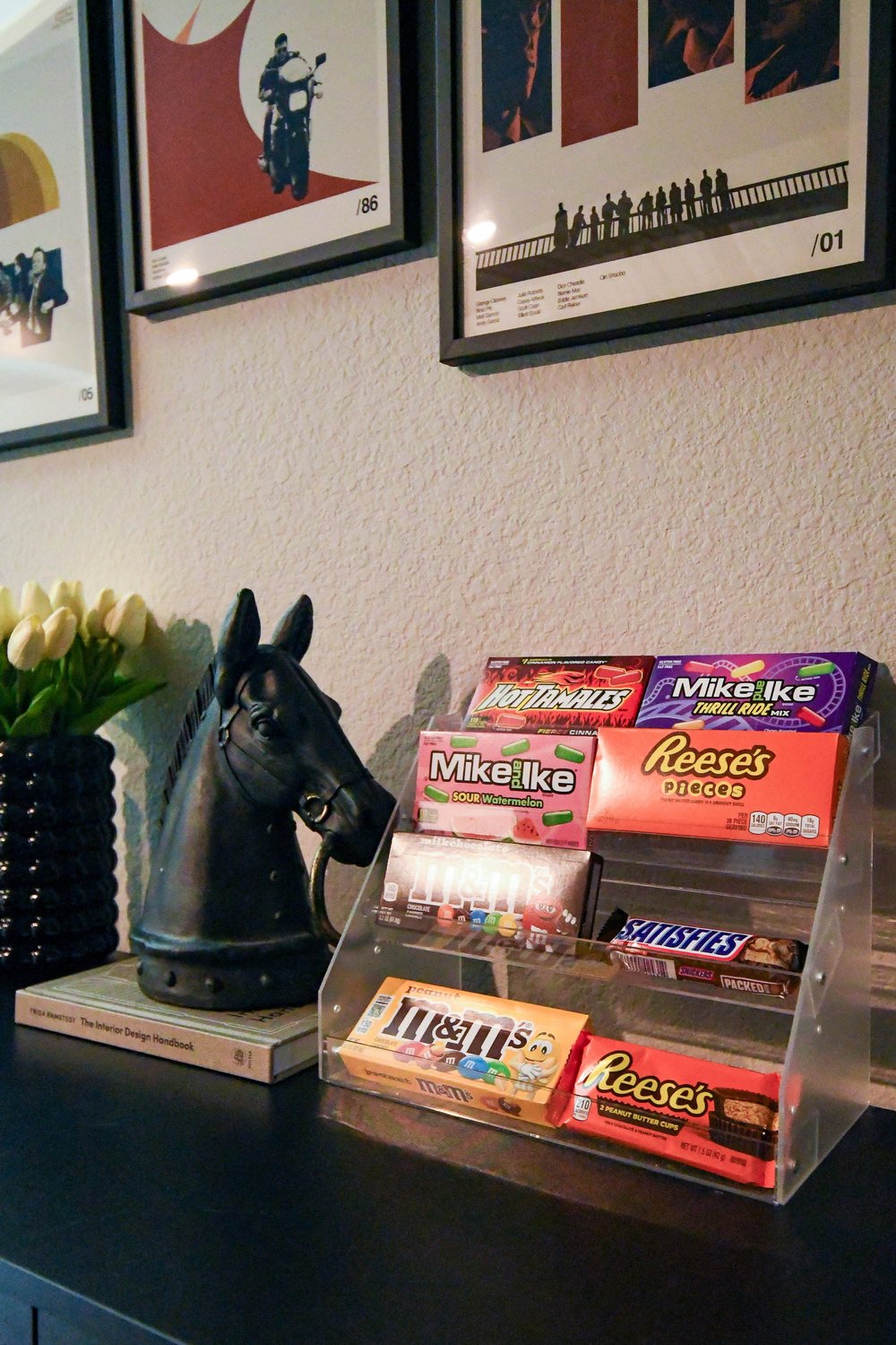 Candy display and a black horse head bust on the concession cabinet